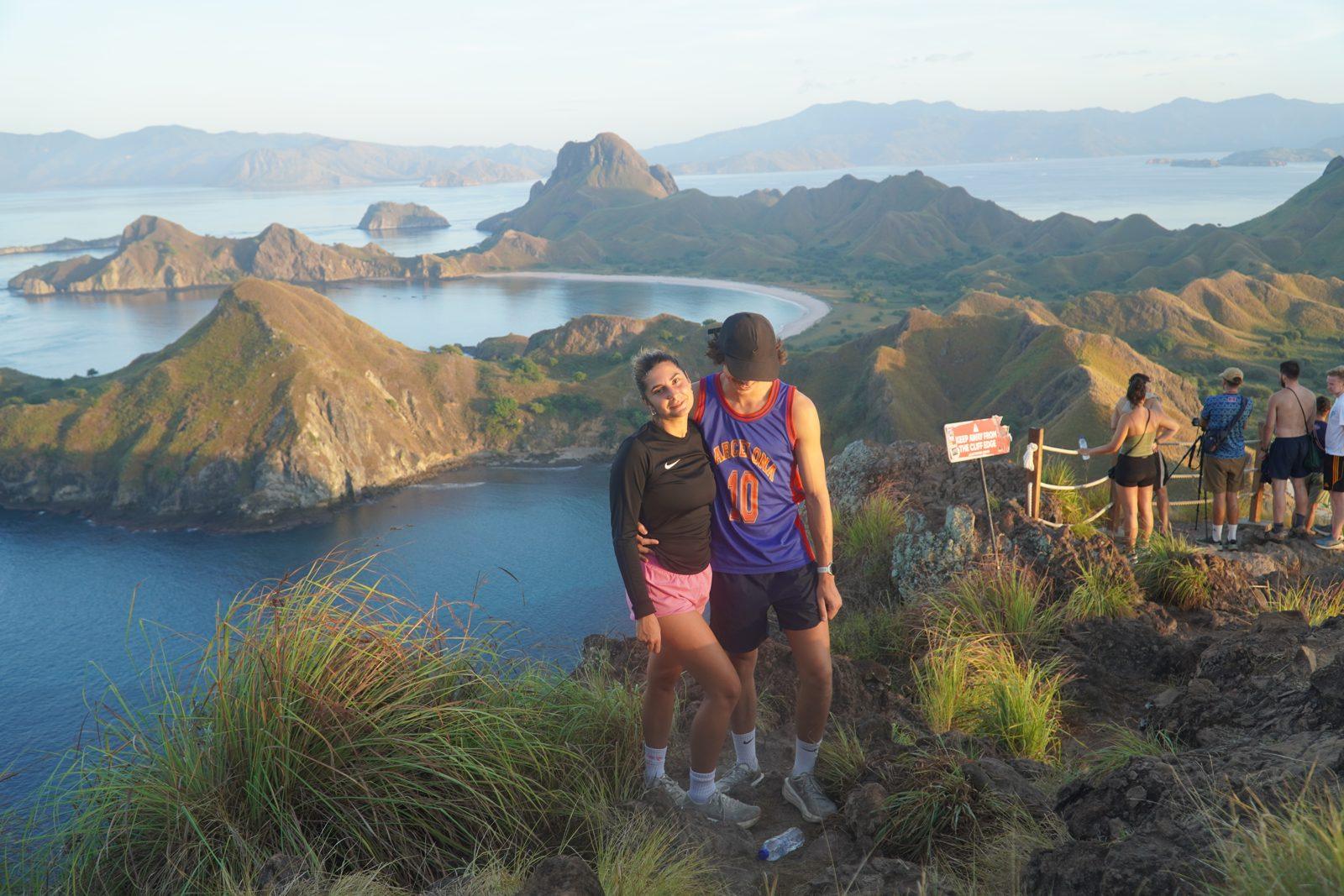Padar – Couple at rail, bays, golden light (Real photo from a Komodo Explorer trip)