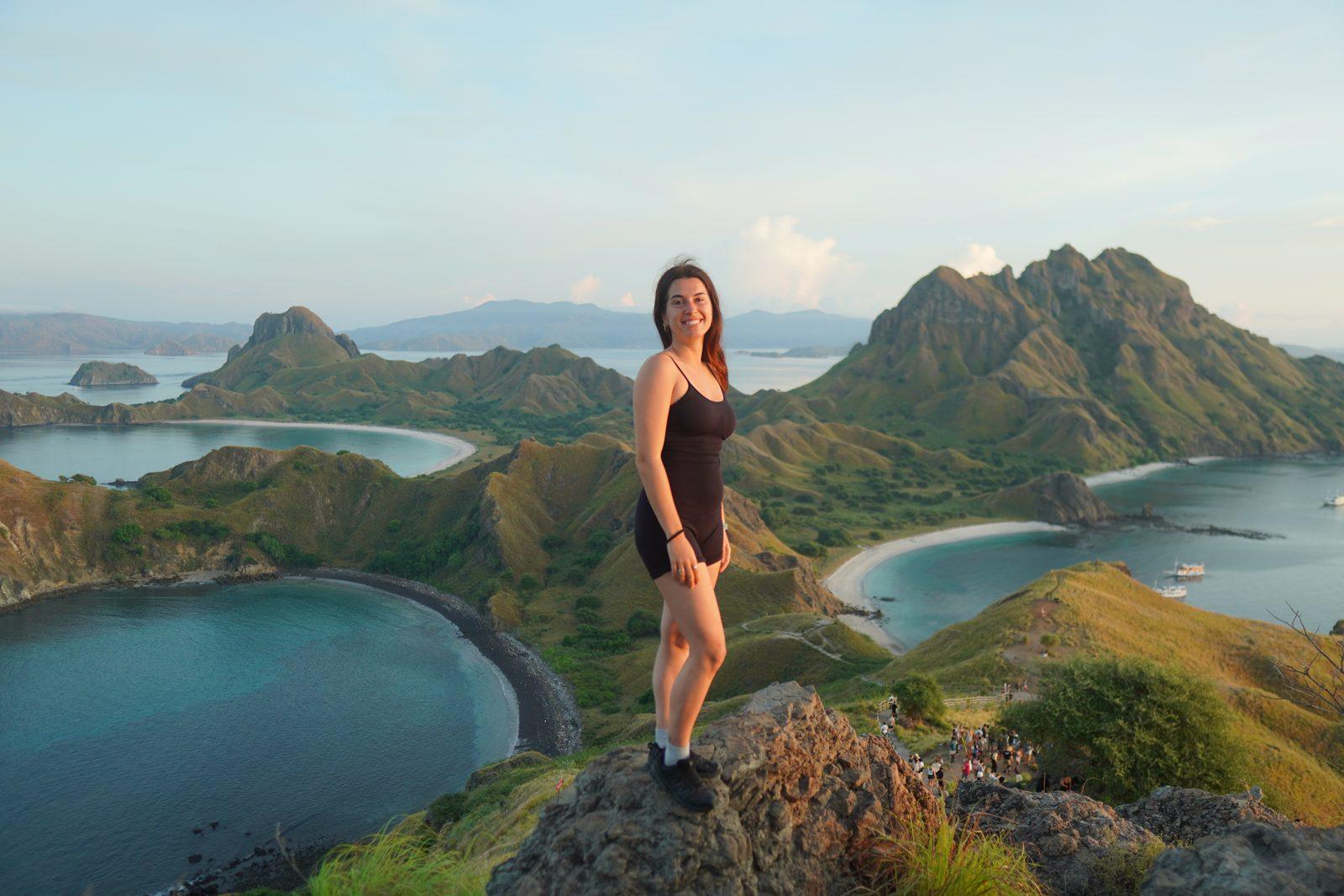 Padar – woman on ridge over three bays (Real photo from a Komodo Explorer trip)