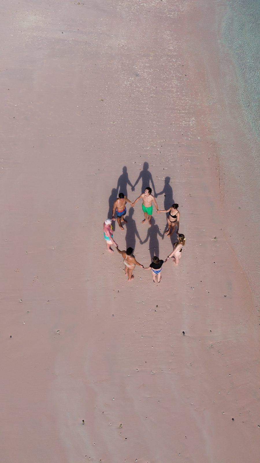 Pink Beach – Aerial group in circle on pink sand (Real photo from a Komodo Explorer trip)
